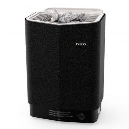 Un sauna Poêle Tylö Sense Combi Elite noir avec un dessus blanc, avec des pierres de sauna grises placées à l'intérieur. Le design compact et élégant comprend des évents pour la circulation de l'air et le rayonnement thermique. Le bas du radiateur est doté d'un bouton de commande pour les réglages de température.