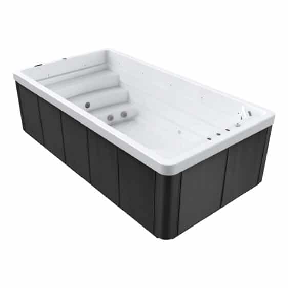 Spa de nage D460 avec panneaux extérieurs sombres, intérieur blanc, marches intégrées et jets latéraux, pompe à chaleur incluse. Ce spa moderne de forme rectangulaire est présenté vide.