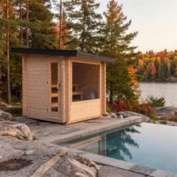 sauna extérieur Avalon en cèdre blanc au bord d’une piscine